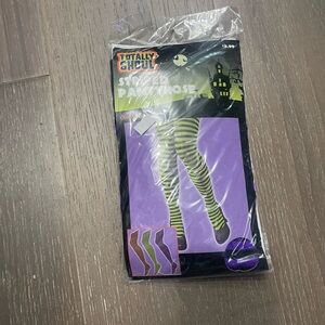 Totally Ghoul Striped pantyhose. NWT one size purple/black